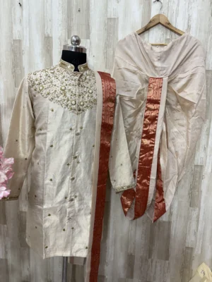 Pure tissue pattu dhoti set with heavy maggam work