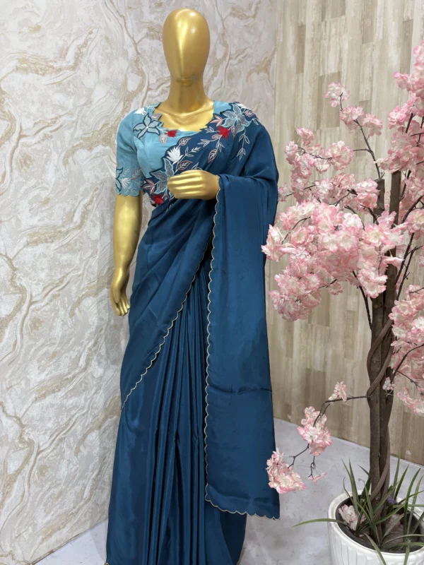 Pure crepe saree having pretty embroidery work on shoulder & all over scalap border paired with embroidery work blouse