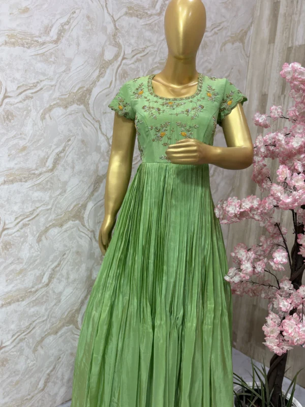Tissue gown with maggam work yoke in pista green