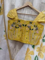 Floral organza lehenga paired with maggam work blouse & dupatta