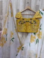 Floral organza lehenga paired with maggam work blouse & dupatta