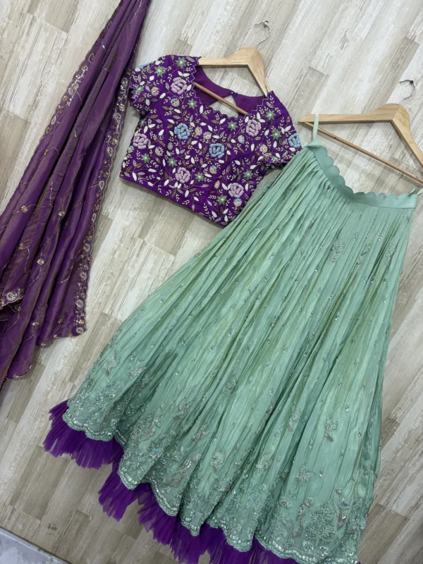 Tissue hand work lehenga paired with heavy maggam work blouse & dupatta