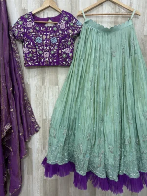 Tissue hand work lehenga paired with heavy maggam work blouse & dupatta