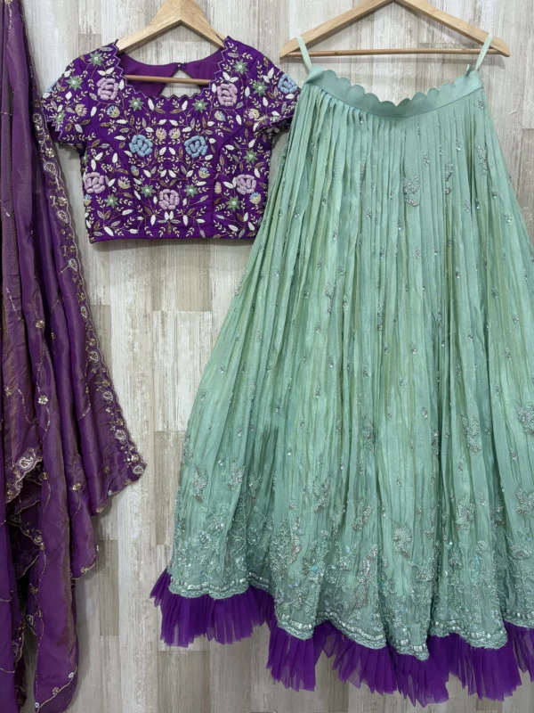 Tissue hand work lehenga paired with heavy maggam work blouse & dupatta
