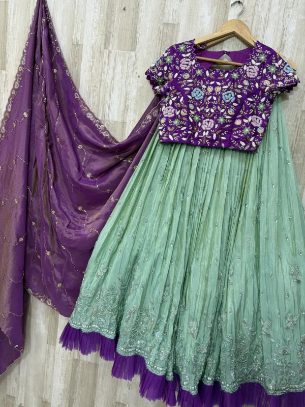 Tissue hand work lehenga paired with heavy maggam work blouse & dupatta