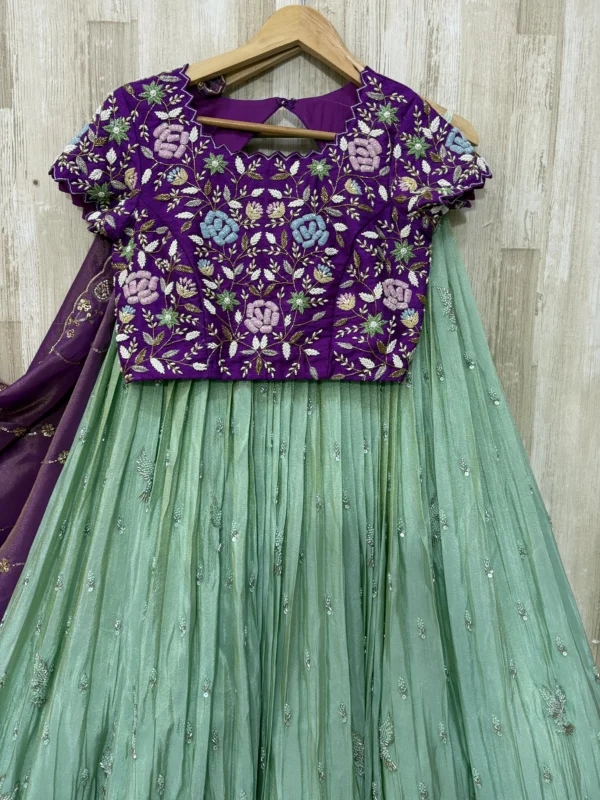 Tissue hand work lehenga paired with heavy maggam work blouse & dupatta