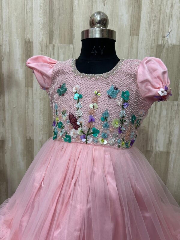 Beautiful designer net frock with heavy maggam work