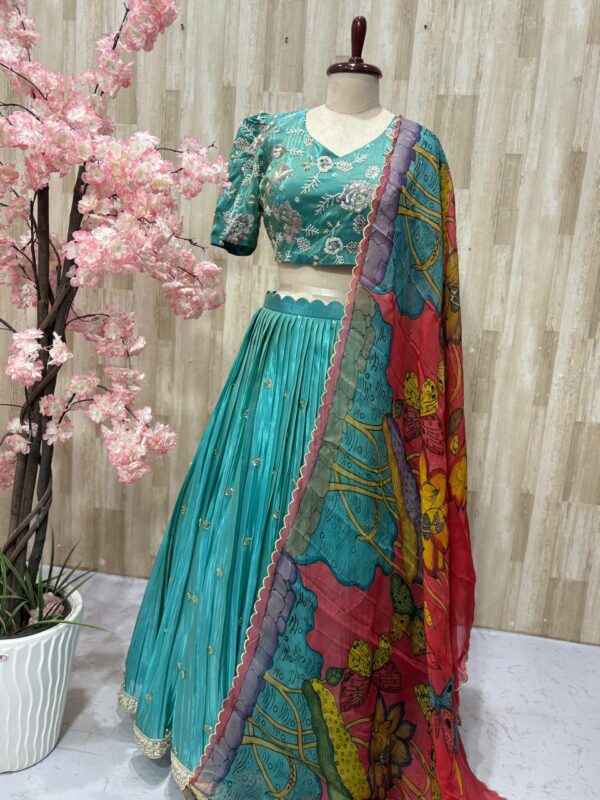 Tissue lehenga paired with heavy maggam work blouse & dupatta