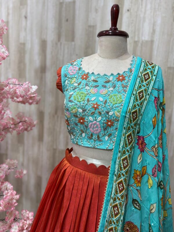Tissue legenga paired with heavy maggam work blouse and kalamkari dupatta