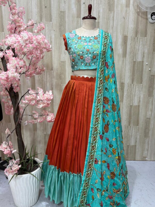 Tissue legenga paired with heavy maggam work blouse and kalamkari dupatta