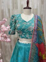 Tissue lehenga paired with heavy maggam work blouse & dupatta