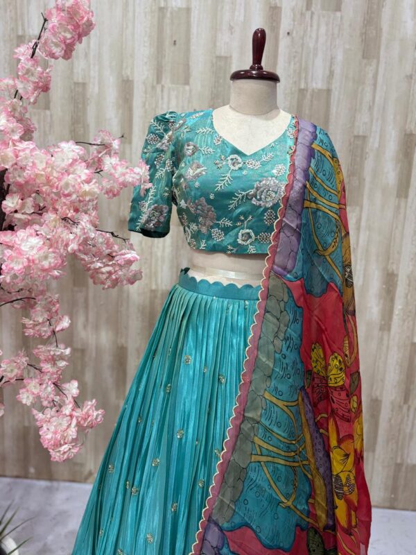 Tissue lehenga paired with heavy maggam work blouse & dupatta