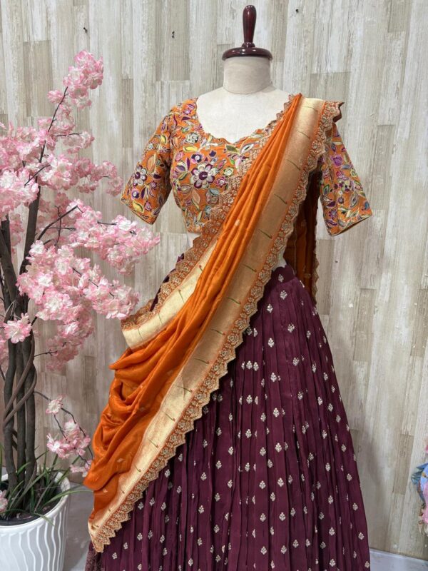 Hand work lehenga with rich border paired with beautiful sequin work floral blouse & pithani dupatta