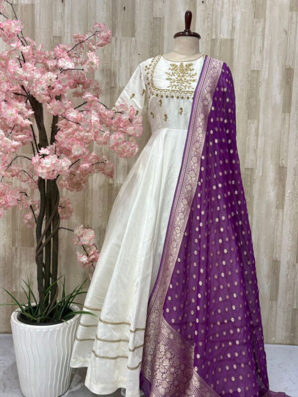 Rawsilk long gown with heavy maggam work on yoke part & tissue dupatta