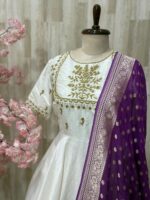 Rawsilk long gown with heavy maggam work on yoke part & tissue dupatta