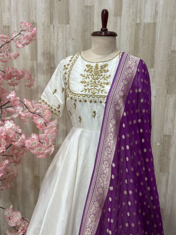 Rawsilk long gown with heavy maggam work on yoke part & tissue dupatta