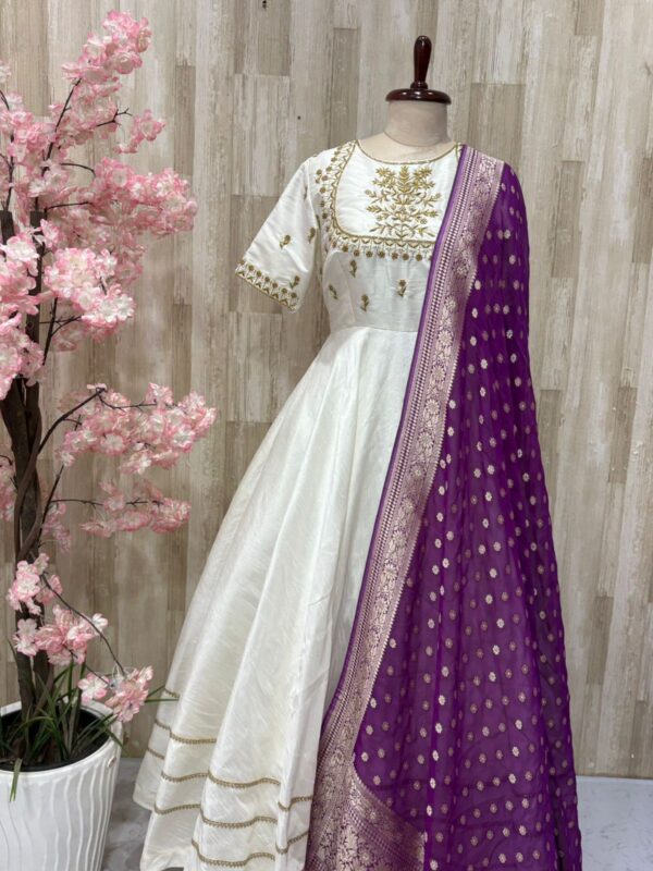 Rawsilk long gown with heavy maggam work on yoke part & tissue dupatta