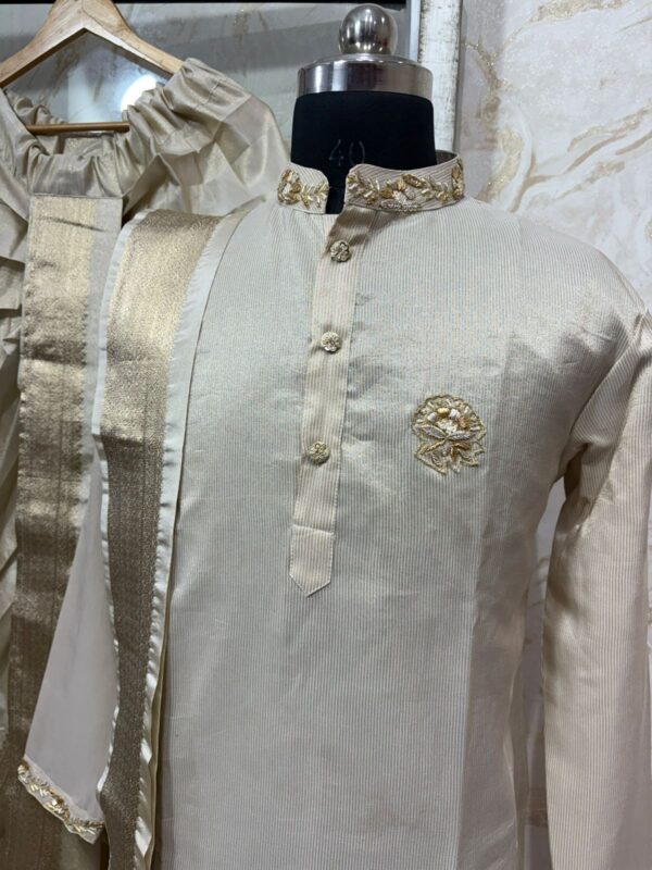 Pure tissue kurta with maggam work on collar & sleeves paired with dhoti & kanduva