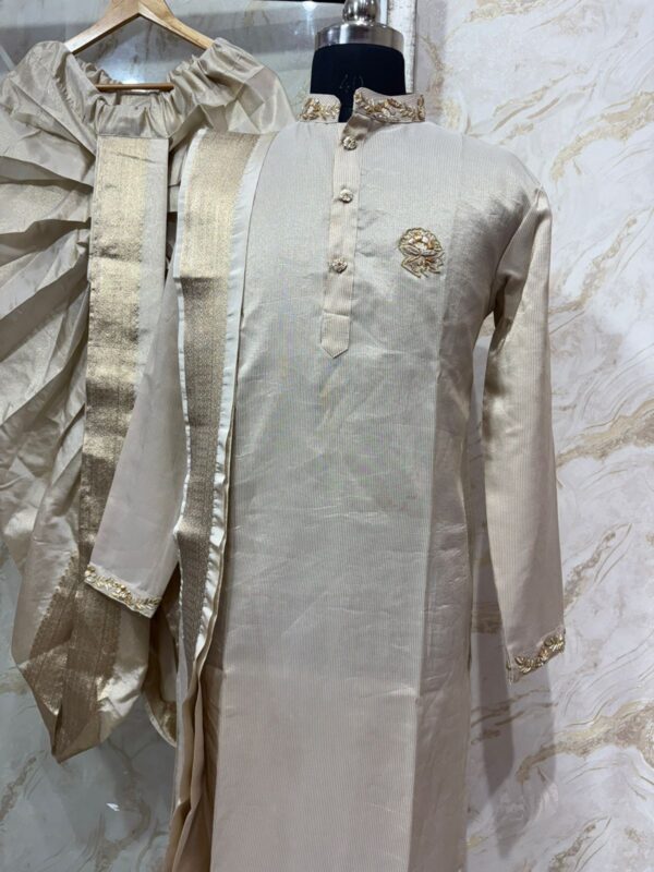 Pure tissue kurta with maggam work on collar & sleeves paired with dhoti & kanduva