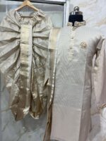 Pure tissue kurta with maggam work on collar & sleeves paired with dhoti & kanduva