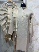 Pure tissue kurta with maggam work on collar & sleeves paired with dhoti & kanduva