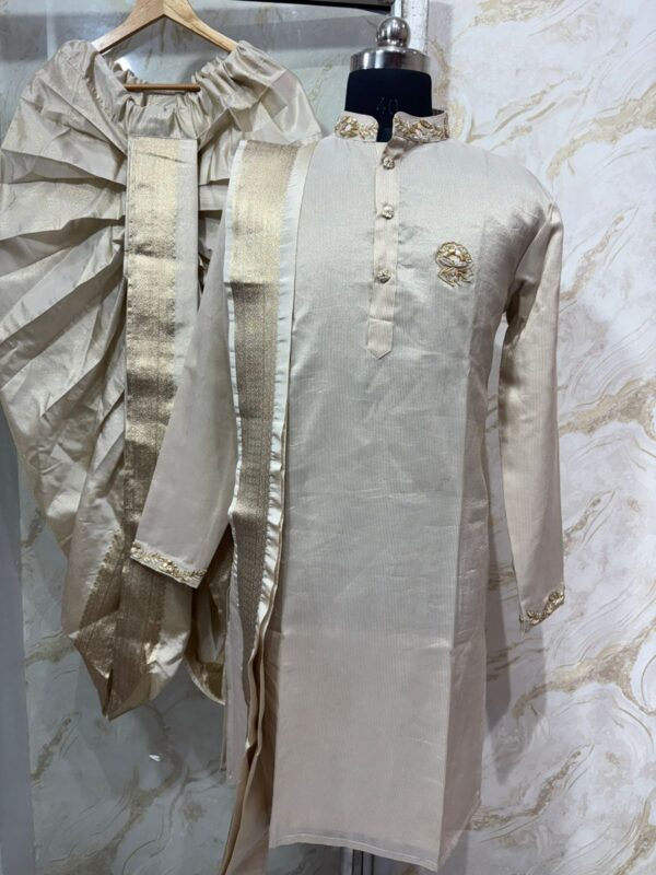 Pure tissue kurta with maggam work on collar & sleeves paired with dhoti & kanduva