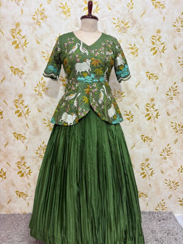 Embroidery work peplum top paired with crepe skirt with heavy flare