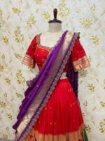 Red colour paithani lehenga paired with maggam work blouse paired with muniya dupatta