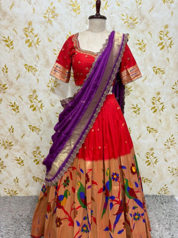 Red colour paithani lehenga paired with maggam work blouse paired with muniya dupatta