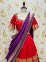 Red colour paithani lehenga paired with maggam work blouse paired with muniya dupatta