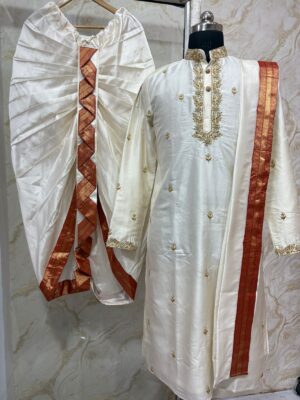 Pure pattu men's kurta with beautiful maggam work collar & sleeves paired with dhoti and kanduva