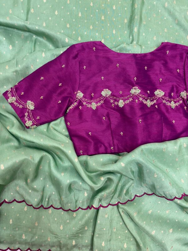 Munga crepe saree having all over zari motifs paired with beautiful maggam work blouse