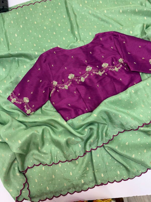 Munga crepe saree having all over zari motifs paired with beautiful maggam work blouse