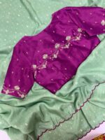 Munga crepe saree having all over zari motifs paired with beautiful maggam work blouse