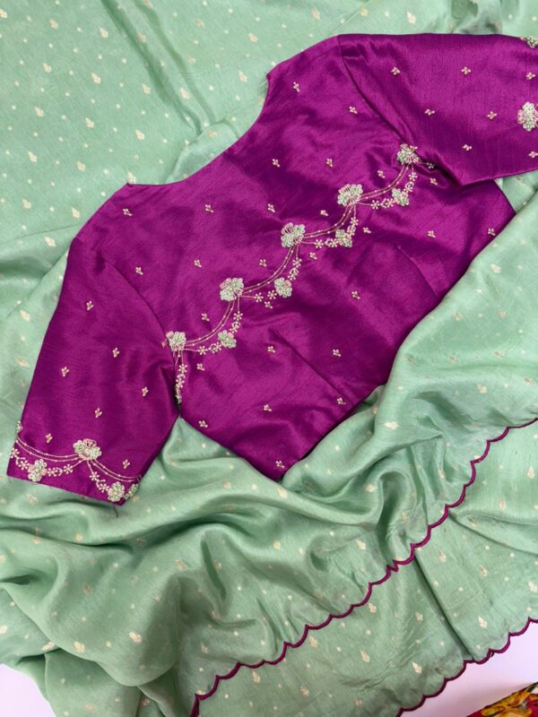 Munga crepe saree having all over zari motifs paired with beautiful maggam work blouse