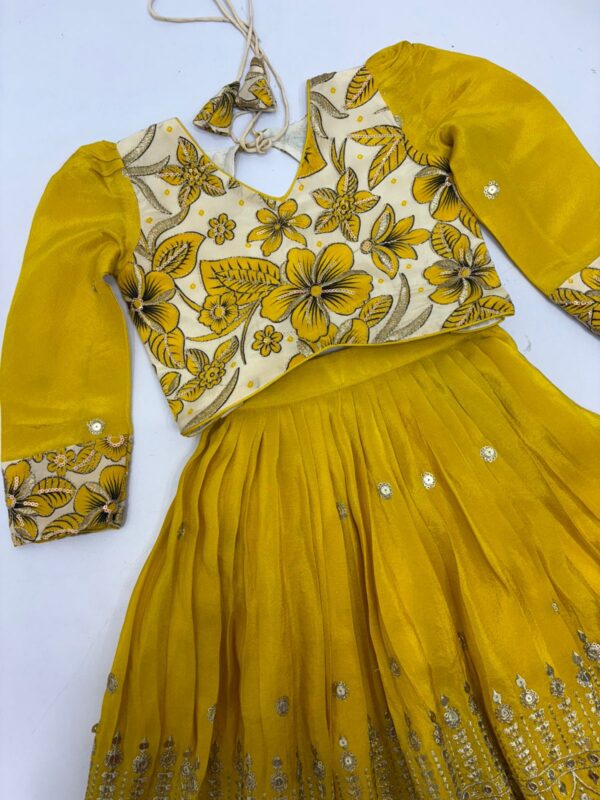 Designer kids tissue skirt having beautiful sequin work paired with floral blouse