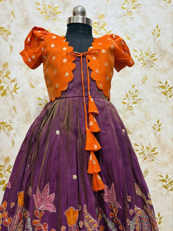 Tissue frock with sequin and embroidery work paired with beautiful tissue over coat