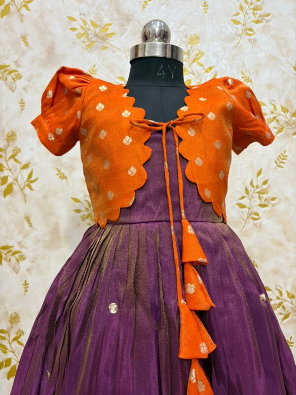 Tissue frock with sequin and embroidery work paired with beautiful tissue over coat