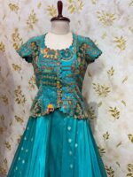 Triple design tissue skirt paired with heavy maggam work blouse