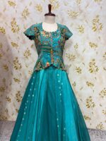 Triple design tissue skirt paired with heavy maggam work blouse