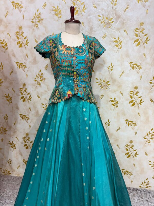 Triple design tissue skirt paired with heavy maggam work blouse