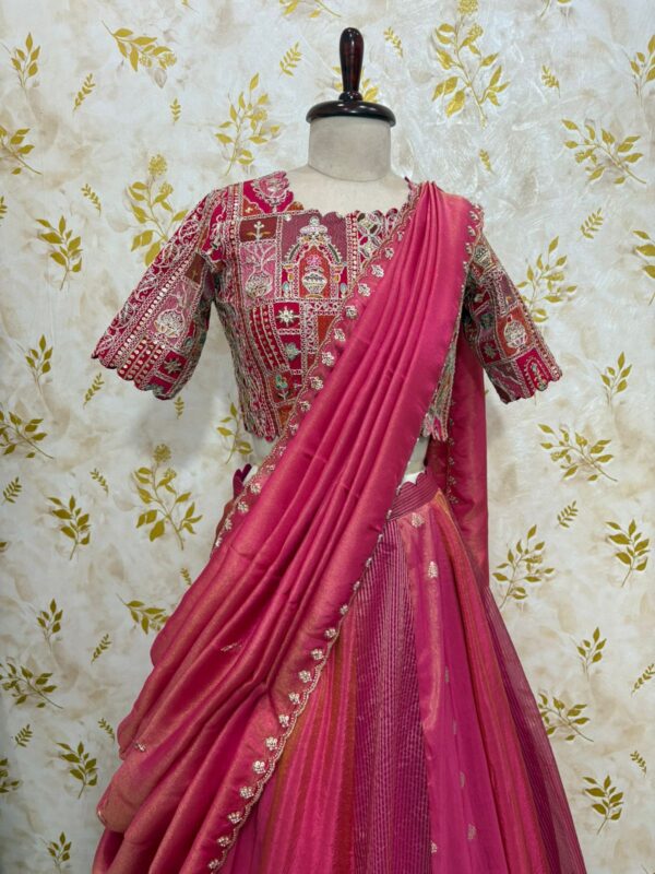 Triple design tissue skirt paired with heavy maggam work blouse paired with tissue dupatta
