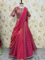 Triple design tissue skirt paired with heavy maggam work blouse paired with tissue dupatta