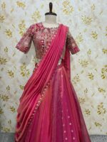 Triple design tissue skirt paired with heavy maggam work blouse paired with tissue dupatta