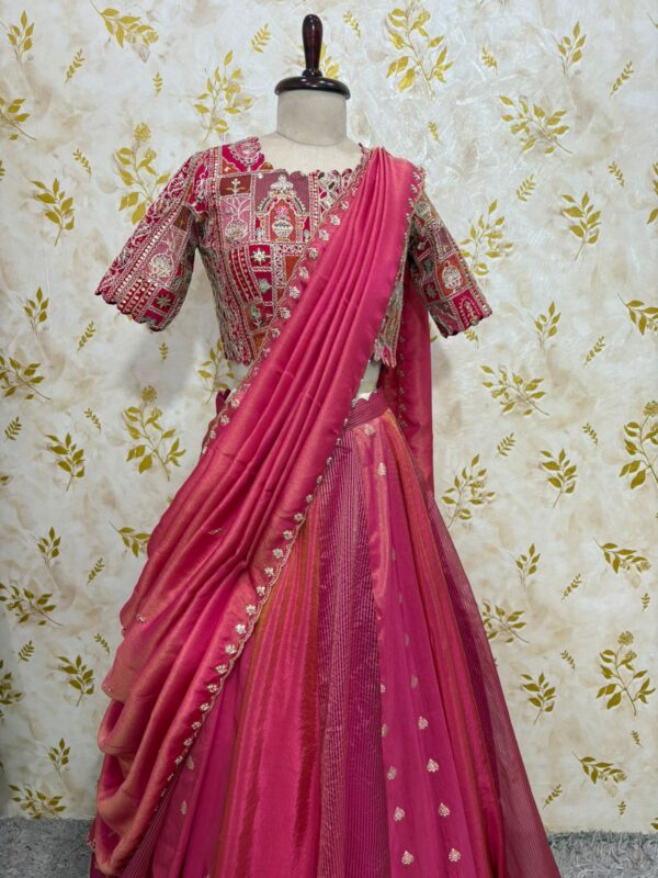 Triple design tissue skirt paired with heavy maggam work blouse paired with tissue dupatta