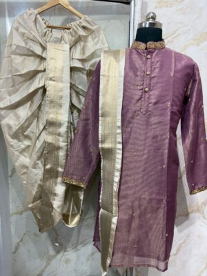 Pure tissue men's kurta with beautiful maggam work on collar & sleeves and all over buttis paired with dhoti & kanduva