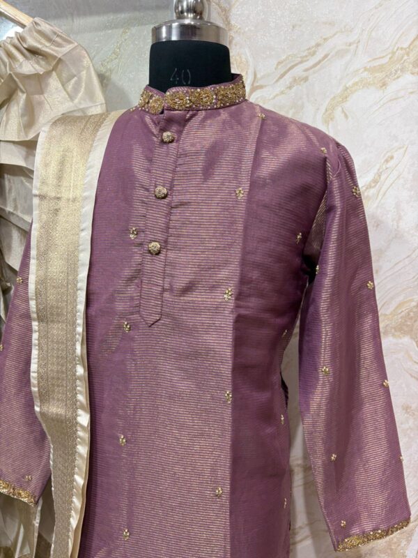 Pure tissue men's kurta with beautiful maggam work on collar & sleeves and all over buttis paired with dhoti & kanduva