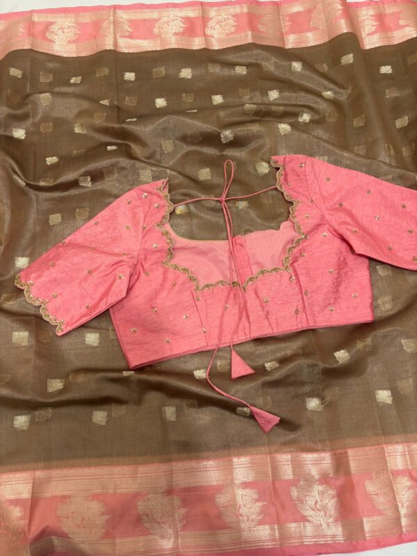 Soft tissue saree with beautiful border paired with pretty maggam work blouse