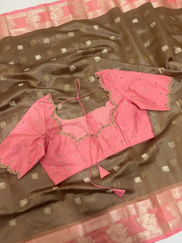 Soft tissue saree with beautiful border paired with pretty maggam work blouse