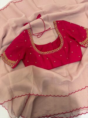 Pure tissue saree with scallop border paired with maggam work blouse